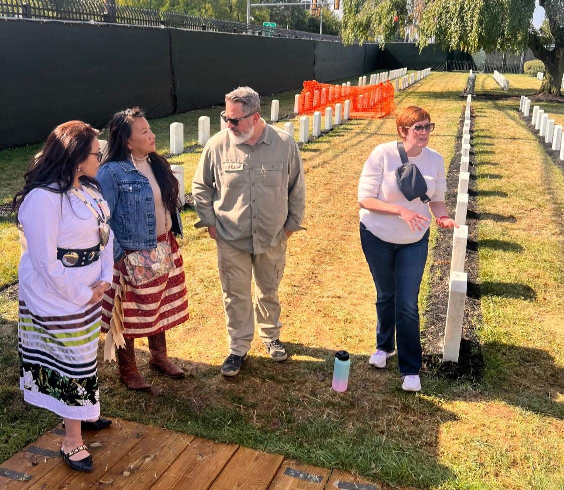 From left, Tamara St. John of the Lake Traverse Reservation and Spirit Lake Tribe Chairwoman Lonna Street talk with Chris Koenig and Meredith Hawkins Trautt, Army Corps of Engineers archeologists and tribal liaisons, at the Carlisle Barracks Post Cemetery in Pennsylvania. The Sisseton Wahpeton representatives were in the state to begin the reinterment process for two children who died at the Carlisle Indian Industrial School in the late 1800s.
