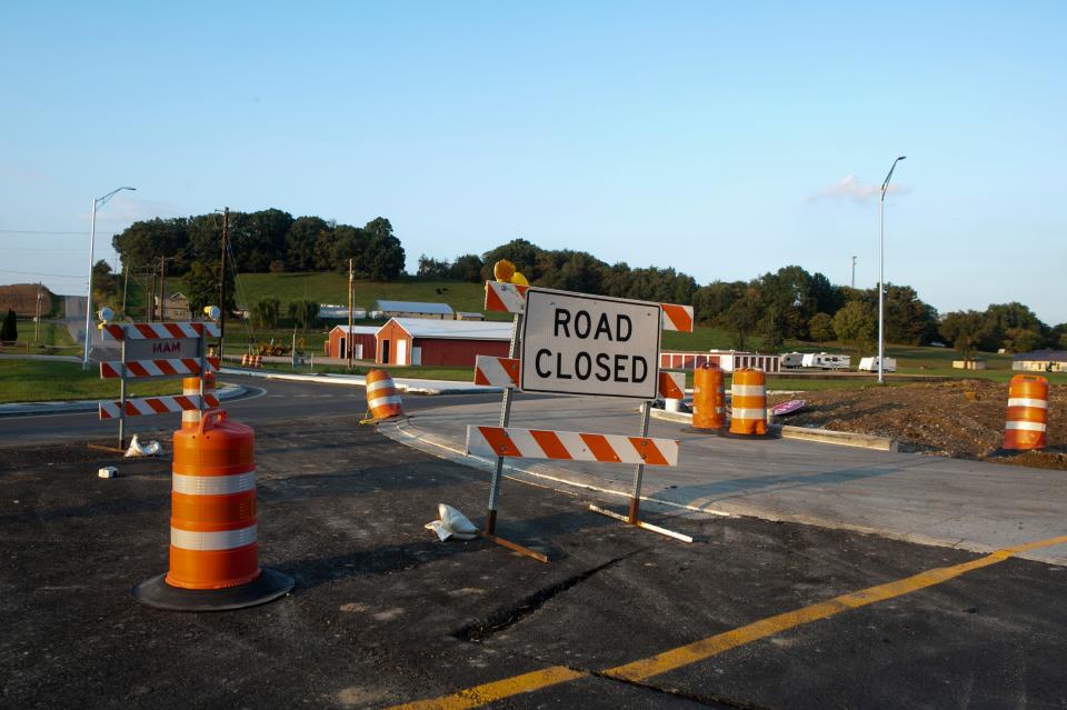 The road closed signs in the middle of the construction on the round-a-bouts at Delmont Road and Ohio 22 are still under construction on September 29, 2023, in Lancaster, Ohio.