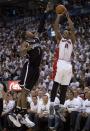 Toronto Raptors guard DeMar DeRozan (10) shoots over Brooklyn Nets guard Joe Johnson (7) during the first half of Game 2 in an NBA basketball first-round playoff series, Tuesday, April 22, 2014, in Toronto. (AP Photo/The Canadian Press, Frank Gunn)