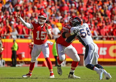 Kansas City Chiefs quarterback Patrick Mahomes (15) throws a pass against the Denver Broncos in the second half at Arrowhead Stadium - Credit: Jay Biggerstaff/USA Today