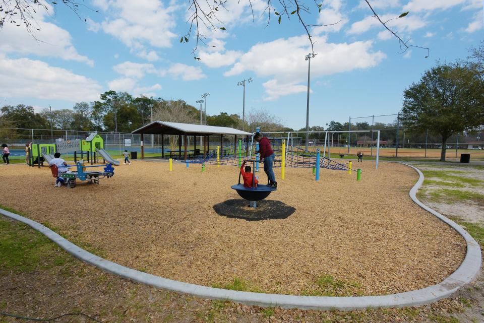 Children play on the new Amari Harley playground at Bruce Park in Jacksonville in 2021. As childhood obesity rises worldwide, such recreational options help children get exercise and maintain a healthy weight.