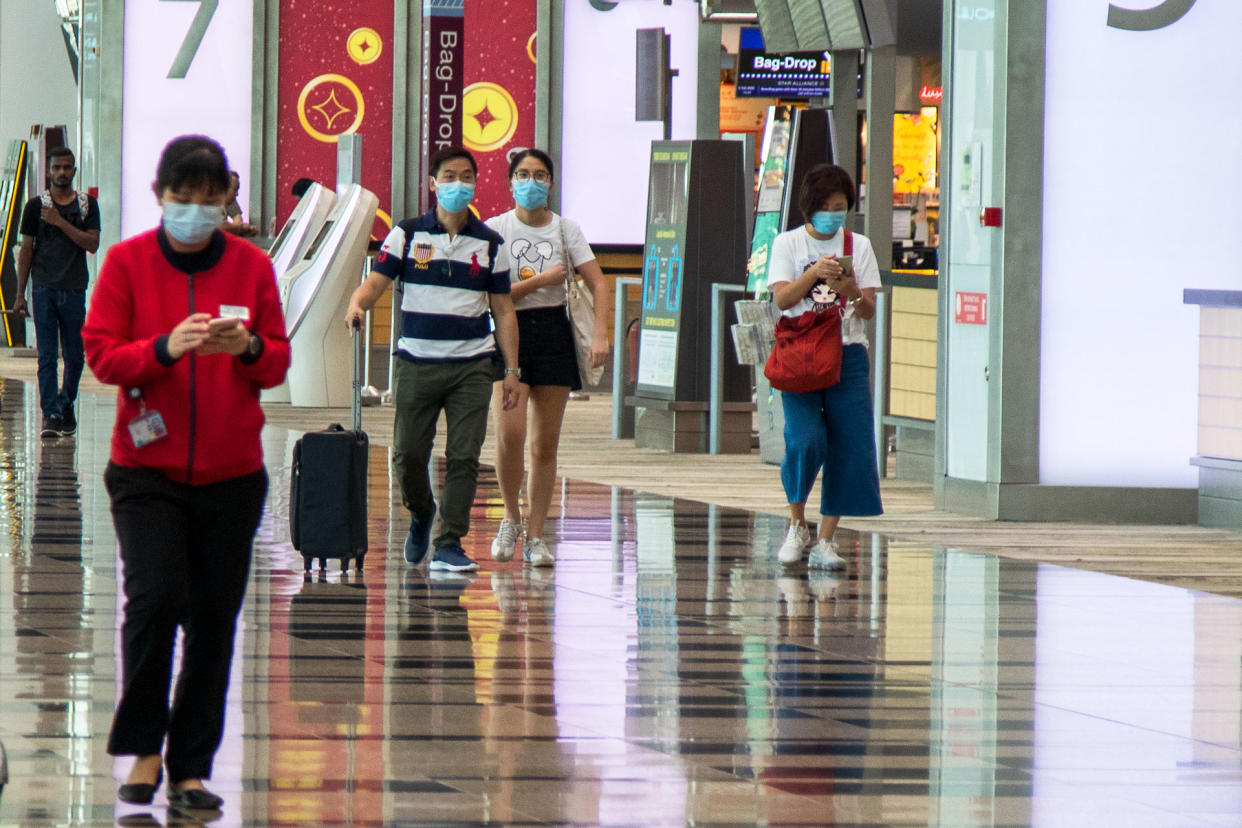 People seen wearing face masks at Changi Airport's Terminal 3 on 6 February 2020. (PHOTO: Dhany Osman / Yahoo News Singapore)
