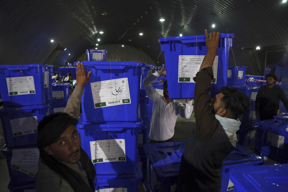 Election commission workers stacks ballot boxes in preparation for the presidential election scheduled for Sept 28, at the Independent Election Commission compound, in Kabul, Afghanistan, Wednesday, Sept. 18, 2019. Afghan officials say around 100,000 members of the country's security forces are ready for polling day. (AP Photo/Rahmat Gul)