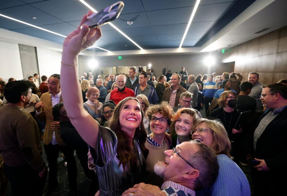 Salt Lake City Mayor Erin Mendenhall takes a selfie with supporters after preliminary results show her in a strong lead at an election night watch party for her reelection campaign in the same office building that houses her campaign headquarters in downtown Salt Lake City on Nov. 21.