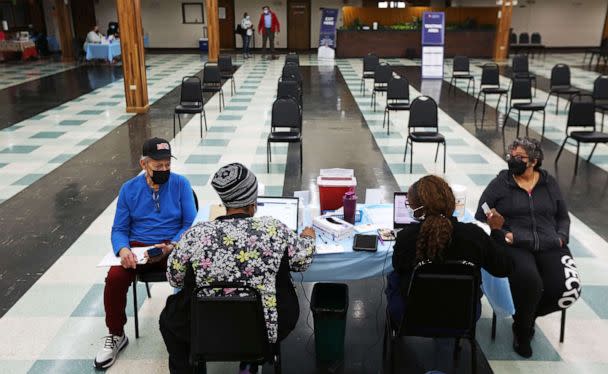 PHOTO: Patients wait to receive their second boosters at a COVID-19 testing and vaccination site at the Harvard Street Neighborhood Health Center in Boston, April 5, 2022. (Boston Globe via Getty Images)