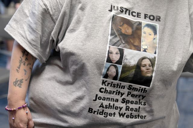 <p>AP Photo/Jenny Kane</p> A person wears a T-shirt with the names of Kristin Smith, Charity Lynn Perry, Joanna Speaks, Ashley Real, and Bridget Webster on it at a May 17 news conference