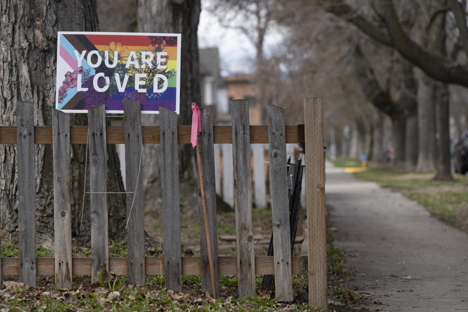 A sign showing support for the LGBTQ community is seen in Missoula, Mont., Tuesday, April 25, 2023. It was little surprise that Missoula, a college town where pride flags are a common sight, sent Zooey Zephyr to the state legislature. Zephyr, the first openly transgender legislator in Montana’s history, was barred last week from speaking on the floor of the legislature by the Republican majority. (AP Photo/Tommy Martino)