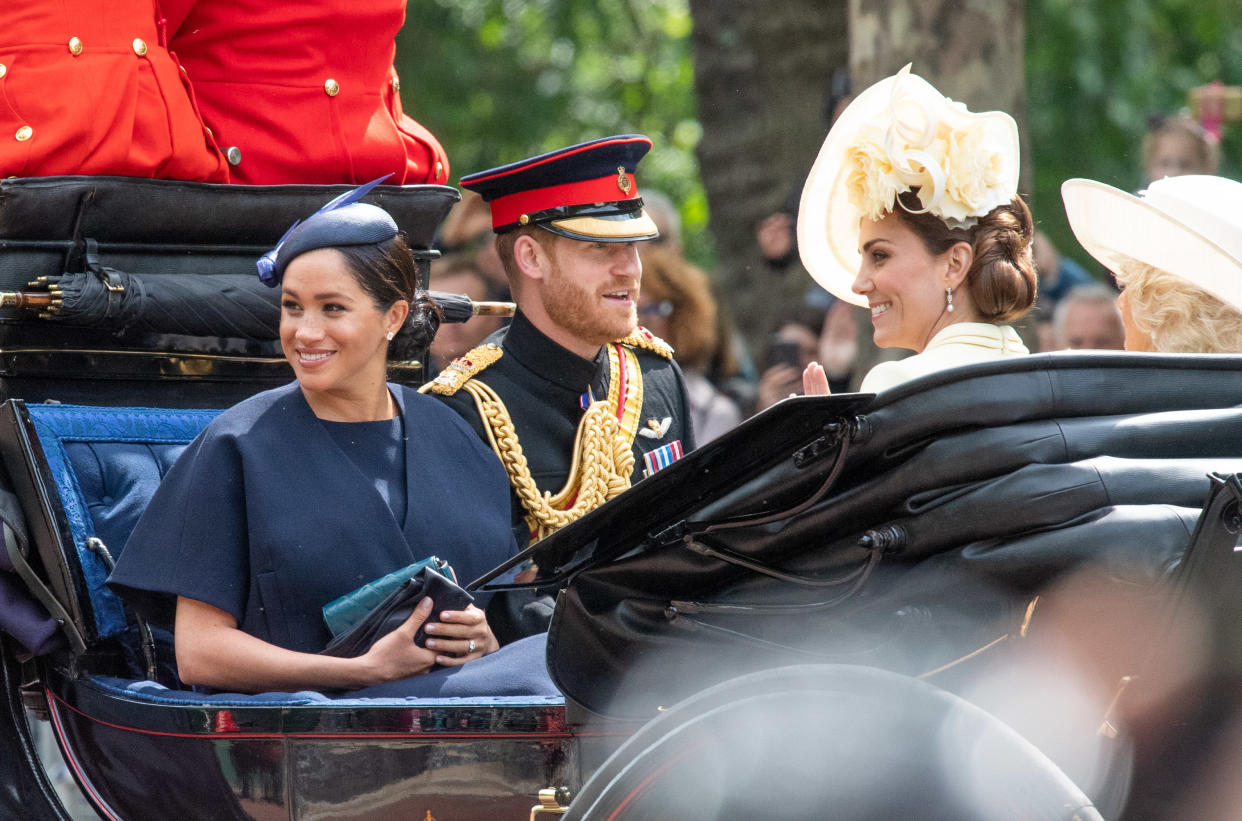 Meghan, Duchess of Sussex rides in an open carriage with Prince Harry, Duke of Sussex  and Catherine, Duchess of Cambridge during Trooping the Colour in London on June 08, 2019.  This was her first public engagement since the birth of her son Archie.