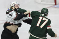 Arizona Coyotes center Liam O'Brien and Minnesota Wild left wing Marcus Foligno (17) fight during the second period of an NHL hockey game, Sunday, Nov. 27, 2022, in St. Paul, Minn. (AP Photo/Stacy Bengs)