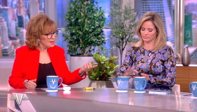 <p>ABC</p> Joy Behar and Sara Haines with Behar's phone on 'The View'