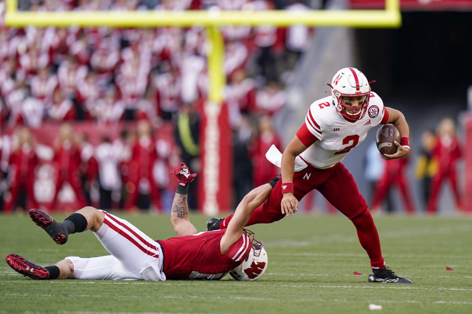 Wisconsin linebacker Nick Herbig stops Nebraska quarterback Adrian Martinez (2) during the first half of an NCAA college football game Saturday, Nov. 20, 2021, in Madison, Wis. (AP Photo/Andy Manis)