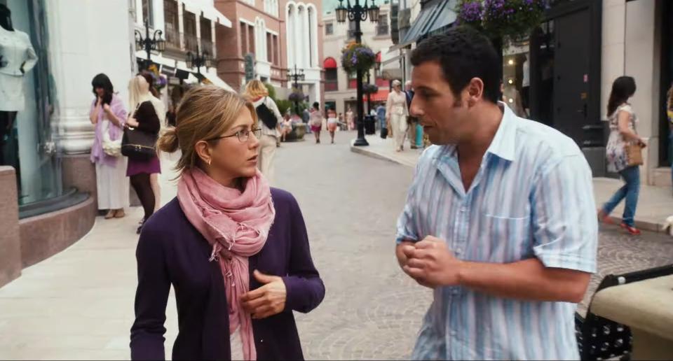 Jennifer Aniston and Adam Sandler's characters are walking down the street