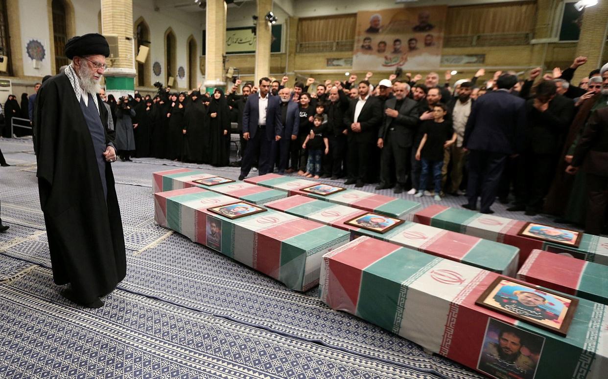 Ayatollah Ali Khamenei looks at the coffins of members of the Islamic Revolutionary Guard Corps who were killed in the Israeli airstrike on the Iranian embassy complex