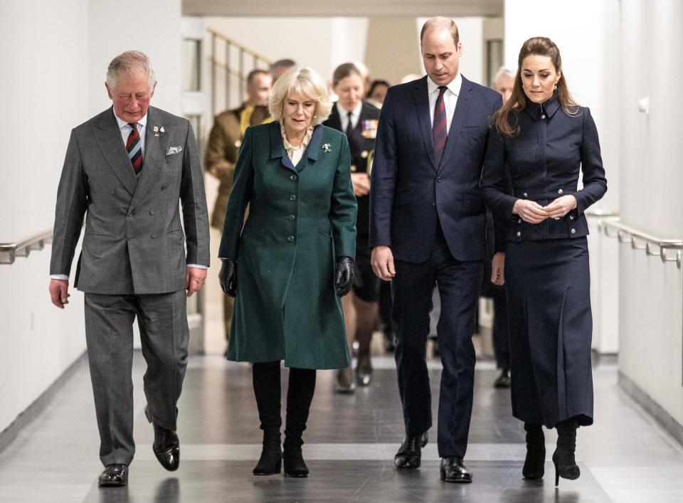 Britain's Prince William, Duke of Cambridge (2R) and his wife Britain's Catherine, Duchess of Cambridge (R) talk with his father Britain's Prince Charles, Prince of Wales (L) and his wife Britain's Camilla, Duchess of Cornwall (2L) during their visit to the Defence Medical Rehabilitation Centre (DMRC) in Loughborough, central England on February 11, 2020. - The DMRC currently provides services to a small group of veterans in the form of the Complex Prosthetic Assessment Clinic (CPAC), which is a joint MOD and NHS England commissioned outpatient clinic. (Photo by Richard Pohle / POOL / AFP) (Photo by RICHARD POHLE/POOL/AFP via Getty Images)