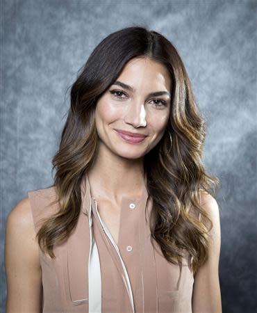 2014 Sports Illustrated cover model Lily Aldridge poses for a portrait in New York February 18, 2014. REUTERS/Carlo Allegri