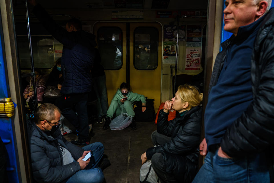 KHARKIV, UKRAINE -- FEBRUARY 24, 2022: Hundreds of people seek shelter underground, on the platform, inside the dark train cars, and even in the emergency exits, in metro subway station as the Russian invasion of Ukraine continues, in Kharkiv, Ukraine, Thursday, Feb. 24, 2022. (MARCUS YAM / LOS ANGELES TIMES)