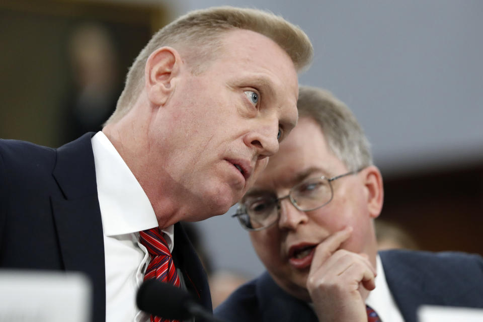Acting Defense Secretary Patrick Shanahan, left, listens to Acting Deputy Secretary David Norquist, Wednesday May 1, 2019, during a House Appropriations subcommittee on budget hearing on Capitol Hill in Washington. (AP Photo/Jacquelyn Martin)