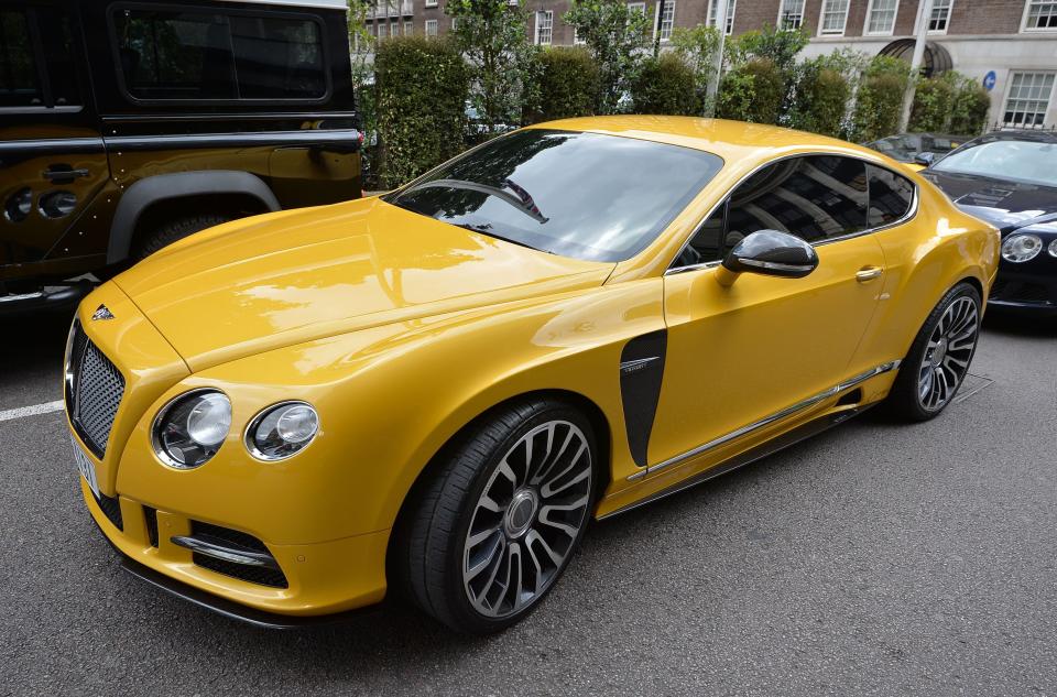 A yellow custom Bentley with Dubai number plates outside the Park Tower Knightsbridge Hotel in London, as August sees hundreds of Middle Easterners flying-in and driving around in supercars.