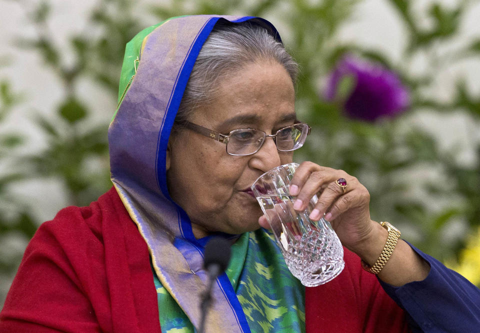 Bangladeshi Prime Minister Sheikh Hasina drinks water during an interaction with journalists in Dhaka, Bangladesh, Monday, Dec. 31, 2018. Bangladesh's ruling alliance won virtually every parliamentary seat in the country's general election, according to official results released Monday, giving Hasina a third straight term despite allegations of intimidation and the opposition disputing the outcome. (AP Photo/Anupam Nath)