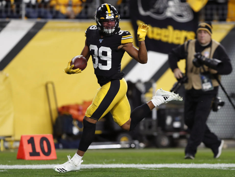 FILE - Pittsburgh Steelers free safety Minkah Fitzpatrick (39) runs for a touchdown after recovering a fumble by Los Angeles Rams quarterback Jared Goff during the first half of an NFL football game in Pittsburgh, Nov. 10, 2019. Once he got traded to the Pittsburgh Steelers, Fitzpatrick quickly emerged as one of the NFL's best playmakers at the position and was chosen as the top safety in the league by The Associated Press. (AP Photo/Keith Srakocic, File)