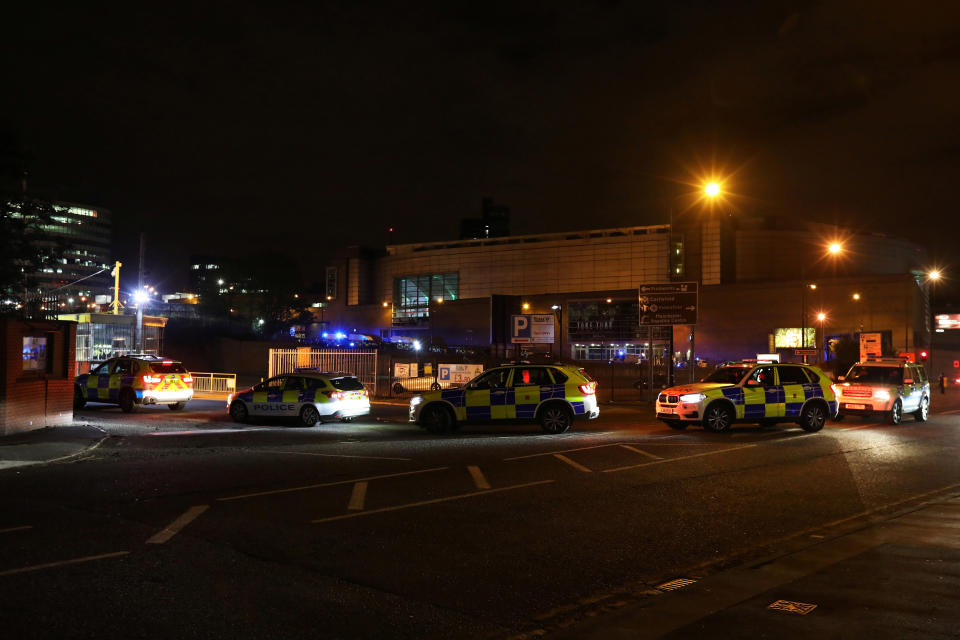 Police vehicles are seen outside the Manchester Arena.&nbsp;