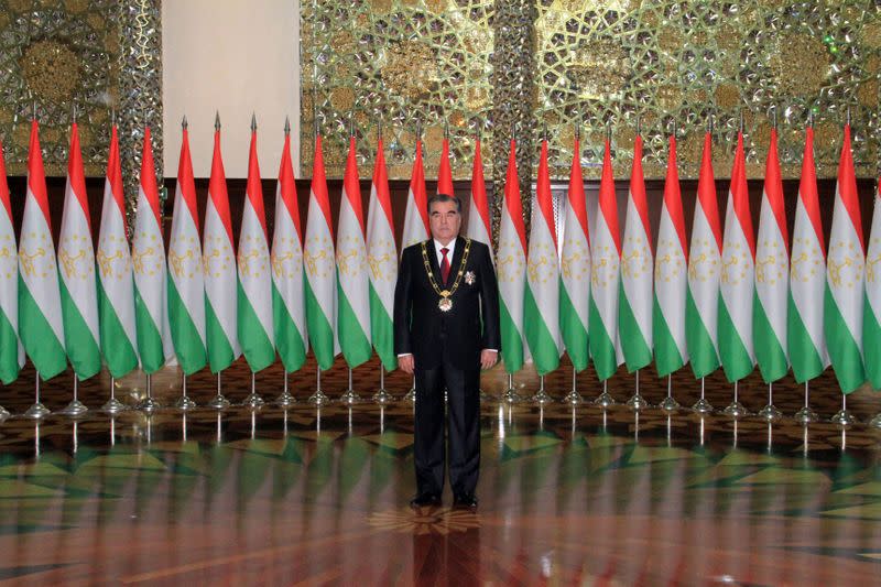FILE PHOTO: Tajikistan's President Rakhmon poses for photographers during his inauguration ceremony in Dushanbe