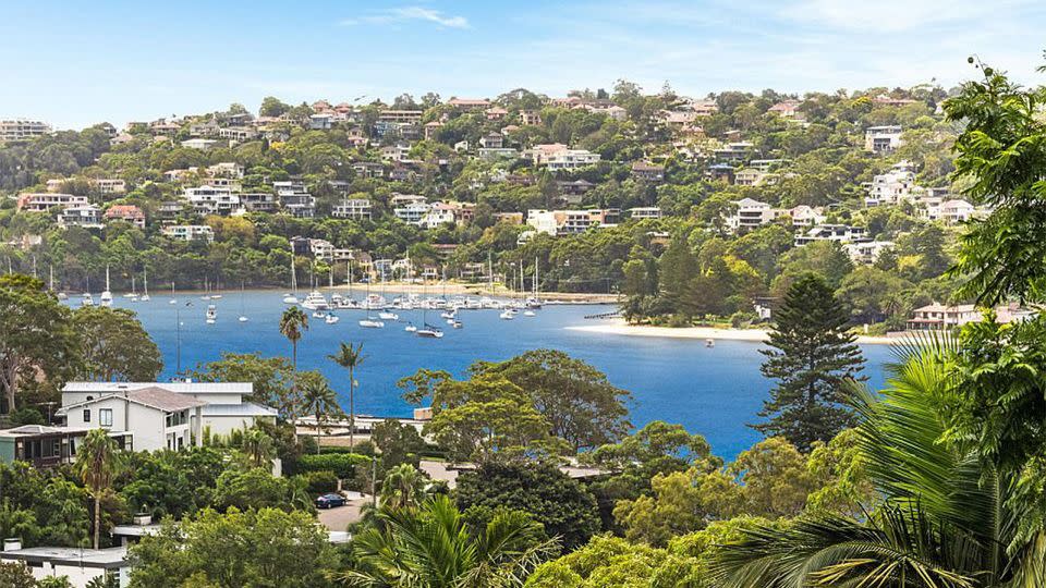 The house offers stunning harbour views, a poolside terrace, a home gym and a private four-storey elevator. Source: Domain