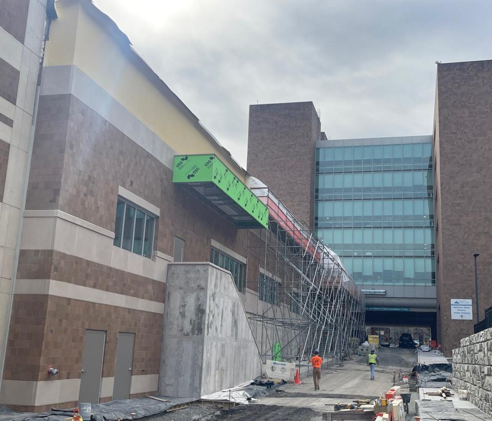 Construction crews are finishing up the exterior of the new Cardiovascular and Surgical Care Pavilion, at left, at Conemaugh Memorial Medical Center. The new building ties into the third, fourth and fifth floors of the hospital's existing footprint.