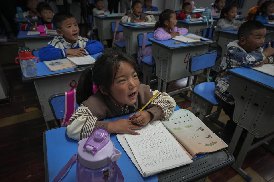 Tibetan students learn Tibetan writing in a first-grade class at the Shangri-La Key Boarding School during a media-organized tour in Dabpa county, Kardze Prefecture, Sichuan province, China on Sept. 5, 2023. (AP Photo/Andy Wong)