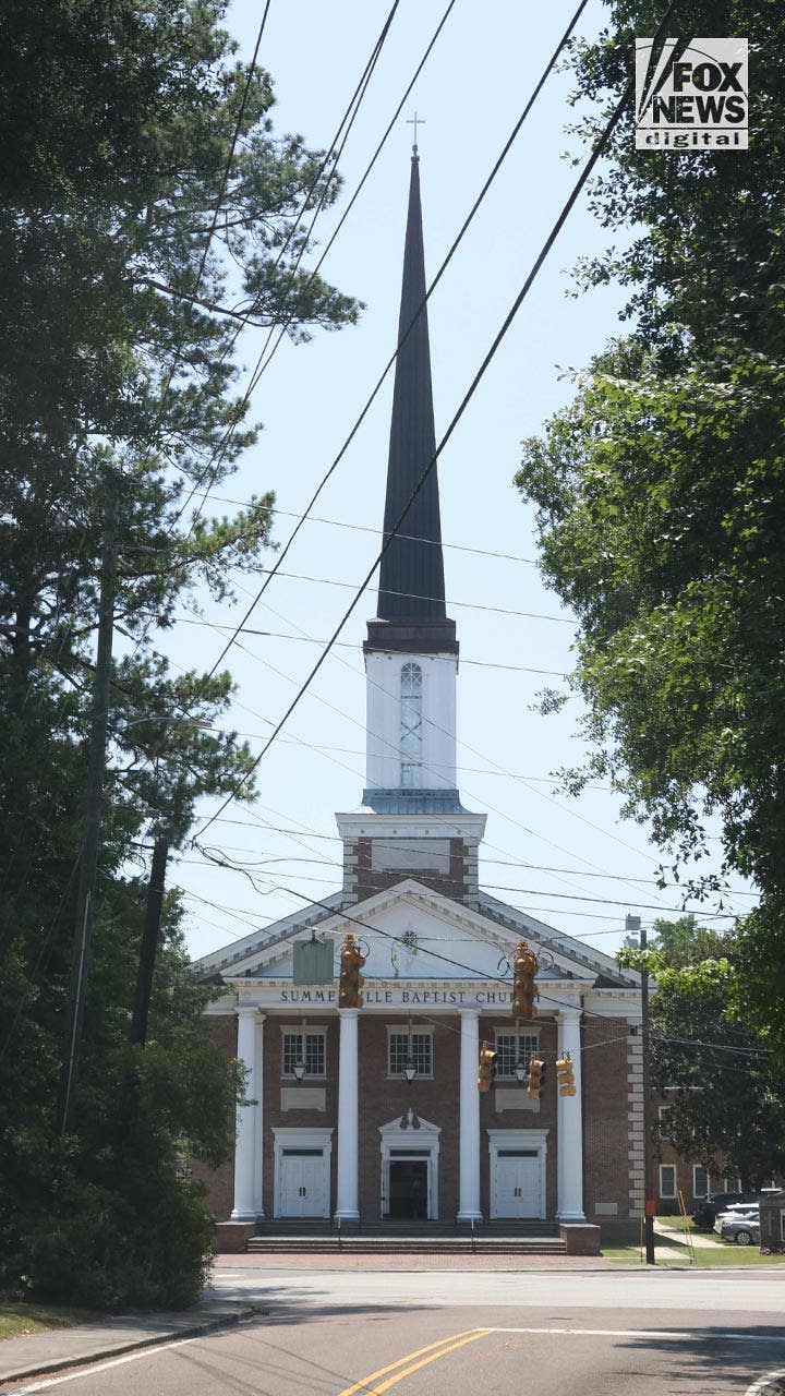 People attend a funeral a church for Johnny Wactor