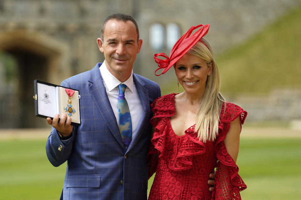 Martin Lewis, and his wife Lara Lewington, with his CBE (Commander of the Order of the British Empire) for services to broadcasting and consumer rights following an investiture ceremony at Windsor Castle. Picture date: Tuesday July 12, 2022.