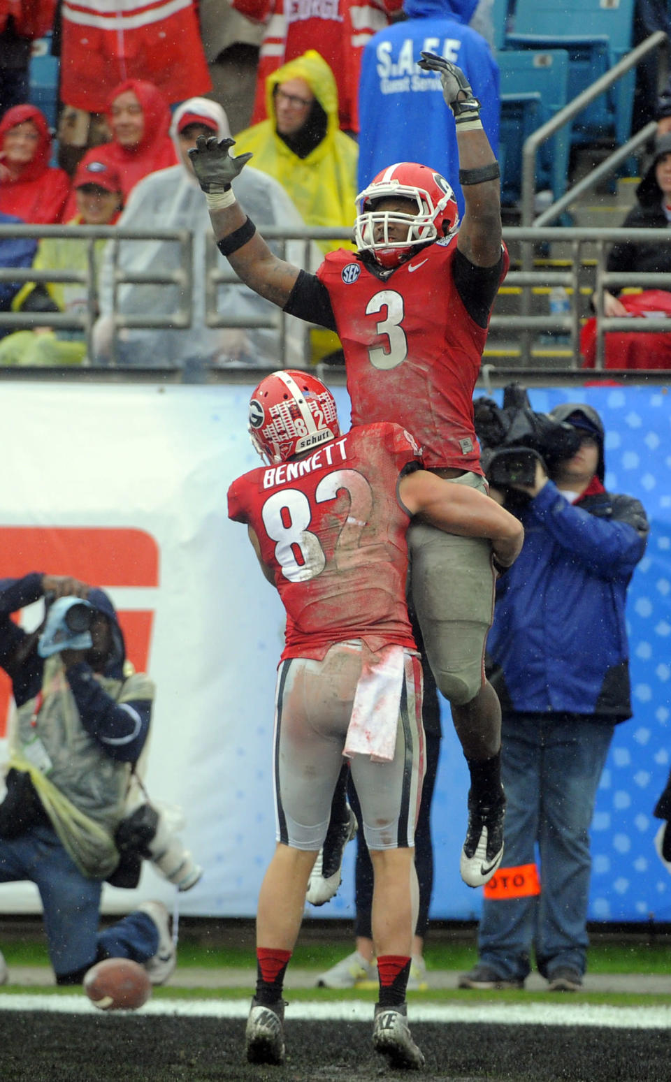 Georgia running back Todd Gurley (3) celebrates a touchdown with wide receiver Michael Bennett (82) during the second half of the Gator Bowl NCAA college football game against Nebraska, Wednesday, Jan. 1, 2014, in Jacksonville, Fla. (AP Photo/Stephen B. Morton)