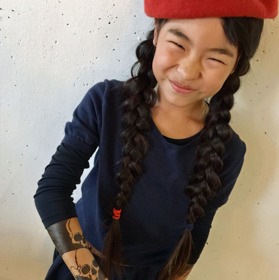 Noko Nishigaki, 9, who sports temporary tattoos, is following in her father the footsteps of her father, a Japanese tattoo artist. Source: Caters