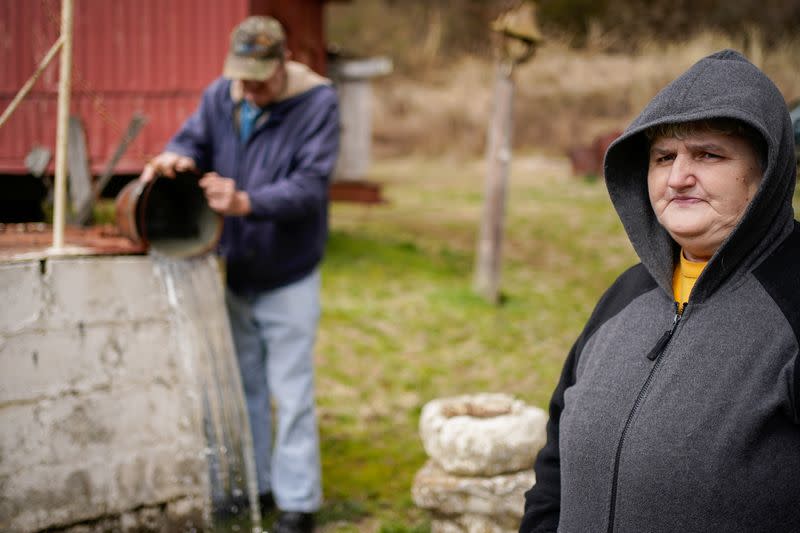 Michael Rower, a landowner who blames a leaky gas well on her property for health problems, stands on her property in Salyersville