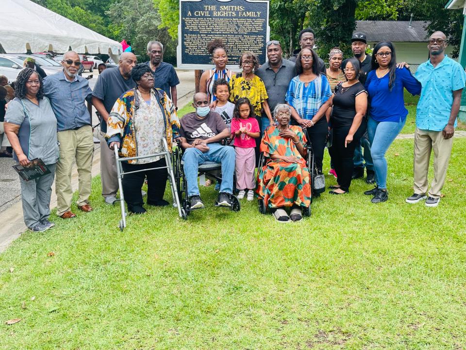The Smith family gathers around the marker to honor Smith relatives May 19. The Smiths played a key role in the civil rights movement in Montgomery.
