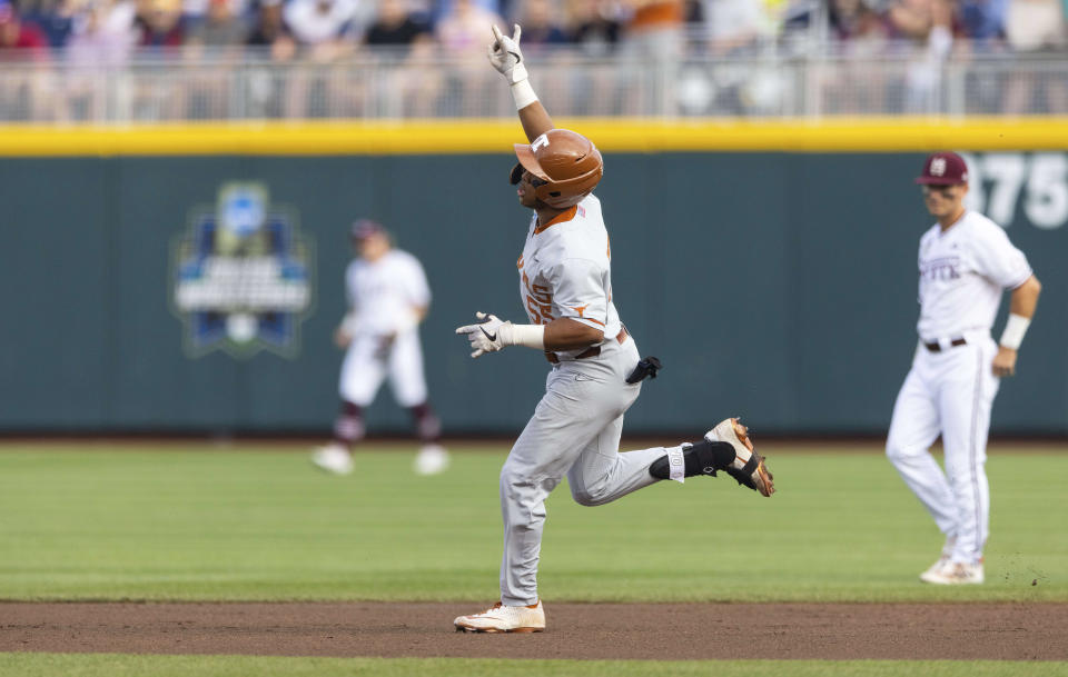 Texas' Cam Williams (55) rounds the bases after hitting a two-run home run in the second inning against Mississippi State during a baseball game in the College World Series, Saturday, June 26, 2021, at TD Ameritrade Park in Omaha, Neb. (AP Photo/Rebecca S. Gratz)