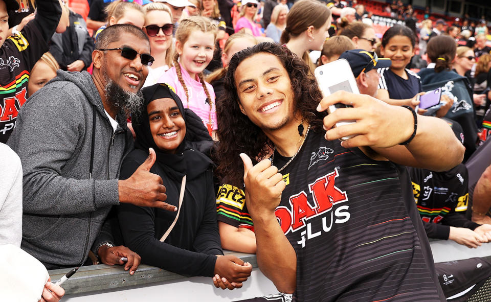 Jarome Luai, pictured here with fans at a Penrith Panthers training session.