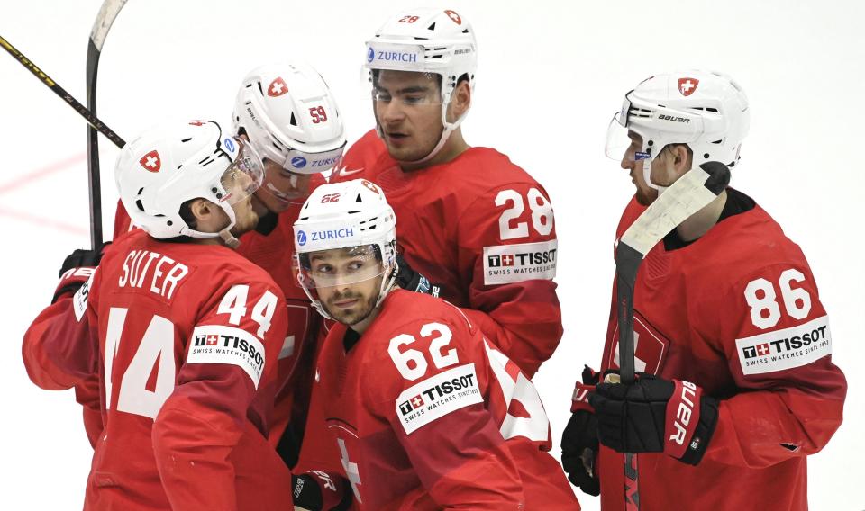(Left to right) Switzerland's forward Pius Suter, also a member of the Detroit Red Wings; Switzerland's forward Dario Simion; Switzerland's forward Denis Malgin; Switzerland's forward Timo Meier and Switzerland's defender Janis Moser celebrate the 2-3 goal by Malgin during the 2022 IIHF Ice Hockey World Championships preliminary round group A match between Germany and Switzerland in Helsinki, Finland, on May 24, 2022.