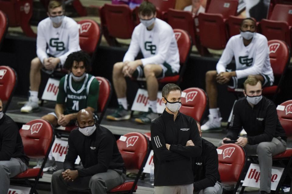 Wisconsin-Green Bay head coach Will Ryan watches during the first half of an NCAA college basketball game against Wisconsin Tuesday, Dec. 1, 2020, in Madison, Wis. (AP Photo/Morry Gash)