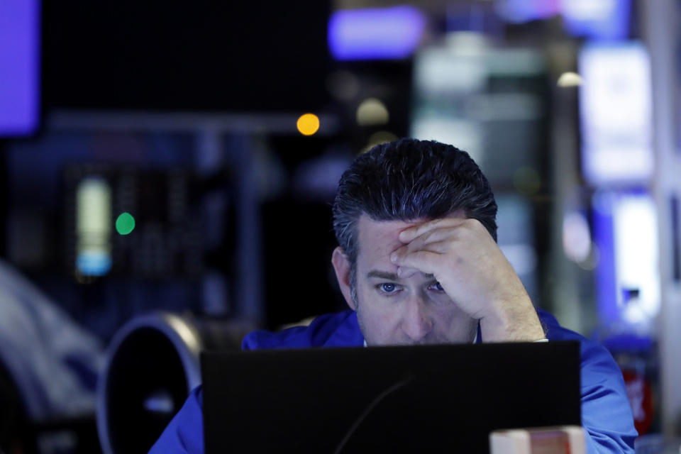 Trader Glenn Kessler works on the floor of the New York Stock Exchange, Tuesday, Feb. 18, 2020. U.S. stocks slipped in early trading Tuesday after technology giant Apple became the most well-known company to warn of a financial hit from the virus outbreak in China. (AP Photo/Richard Drew)