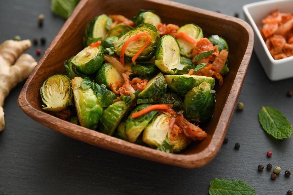 Ginger Roasted Brussels Sprouts with Kimchi has just 137 calories per serving.