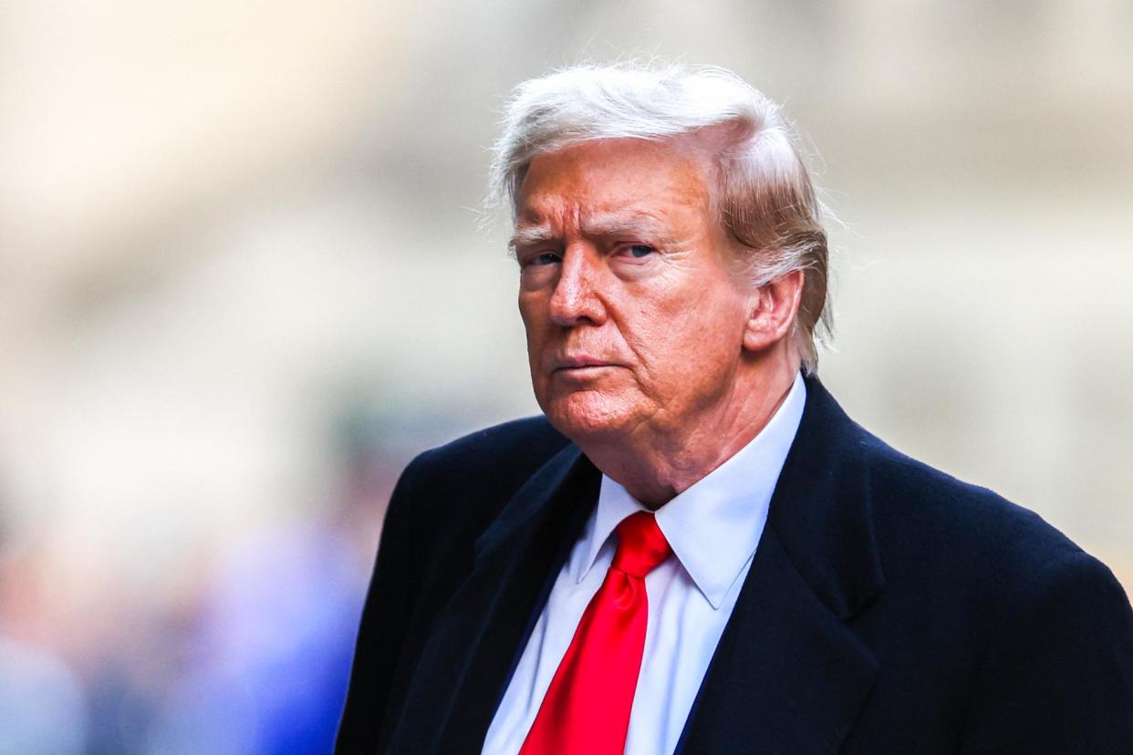 <span>Donald Trump arrives at 40 Wall Street in New York last month after a court hearing to determine the date of his hush-money trial.</span><span>Photograph: Charly Triballeau/AFP/Getty Images</span>
