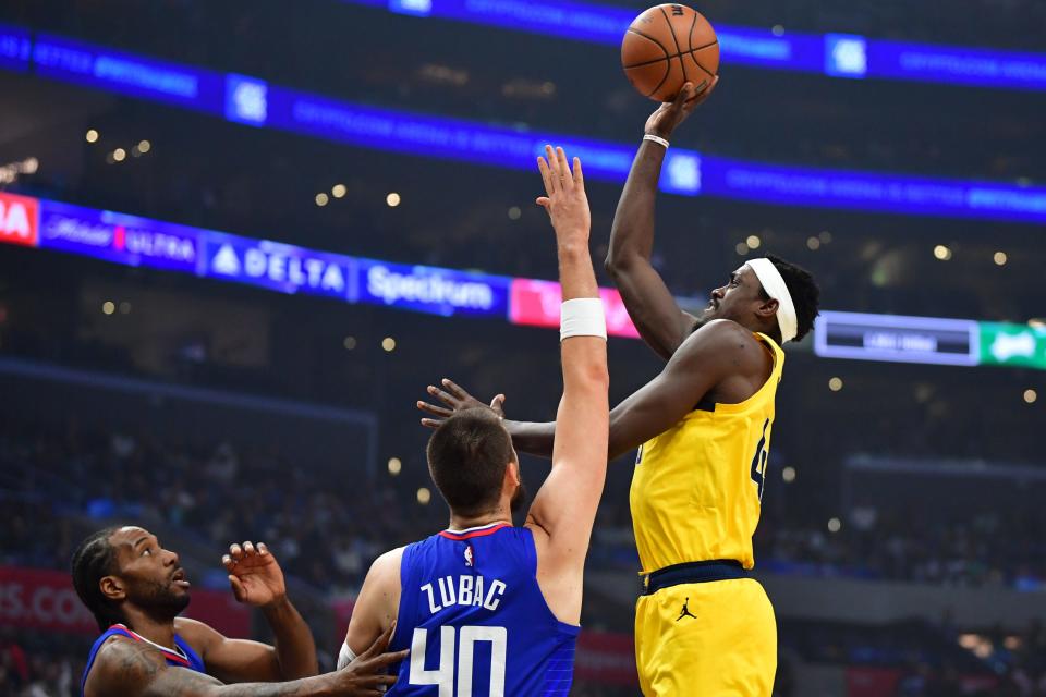 Mar 25, 2024; Los Angeles, California, USA; Indiana Pacers forward Pascal Siakam (43) shoots against Los Angeles Clippers center Ivica Zubac (40) and forward Kawhi Leonard (2) during the first half at Crypto.com Arena. Mandatory Credit: Gary A. Vasquez-USA TODAY Sports