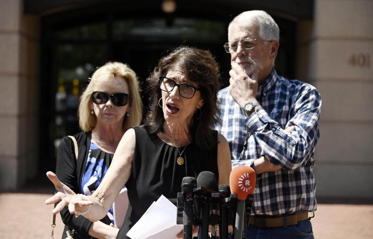Diane Foley (center), the mother of James Foley, and Carl and Marsha Mueller, the parents of Kayla Mueller, speak to reporters outside the a federal courthouse following the sentencing of El Shafee Elsheikh, in Alexandria, Va., Friday.