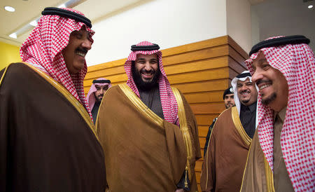 FILE PHOTO: Saudi Arabia's Crown Prince Mohammed Bin Salman and Saudi Prince Miteb bin Abdullah (L) take part in the Annual Horse Race ceremony, in Riyadh, Saudi Arabia, December 30, 2017. Bandar Algaloud/Courtesy of Saudi Royal Court/Handout//File Photo via REUTERS