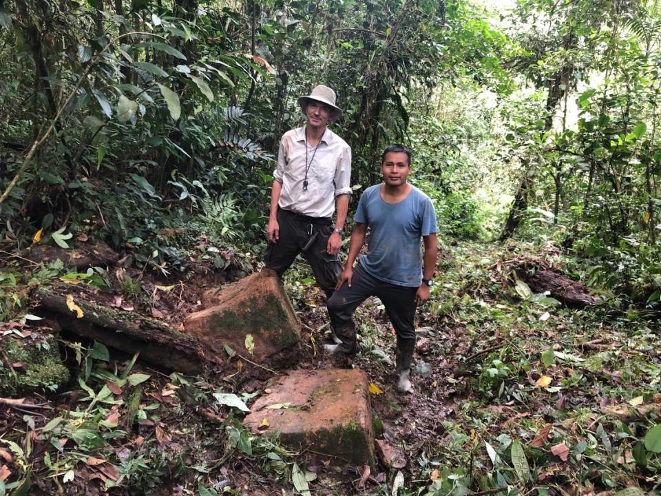 Stefan Ansermet, left, a consulting geologist for Aurania Resources, and Faustino Tsenkush, an exploration geologist for Aurania Resources, stand on the trail they believe is an old Spanish road leading to lost gold mine in southeastern Ecuador.