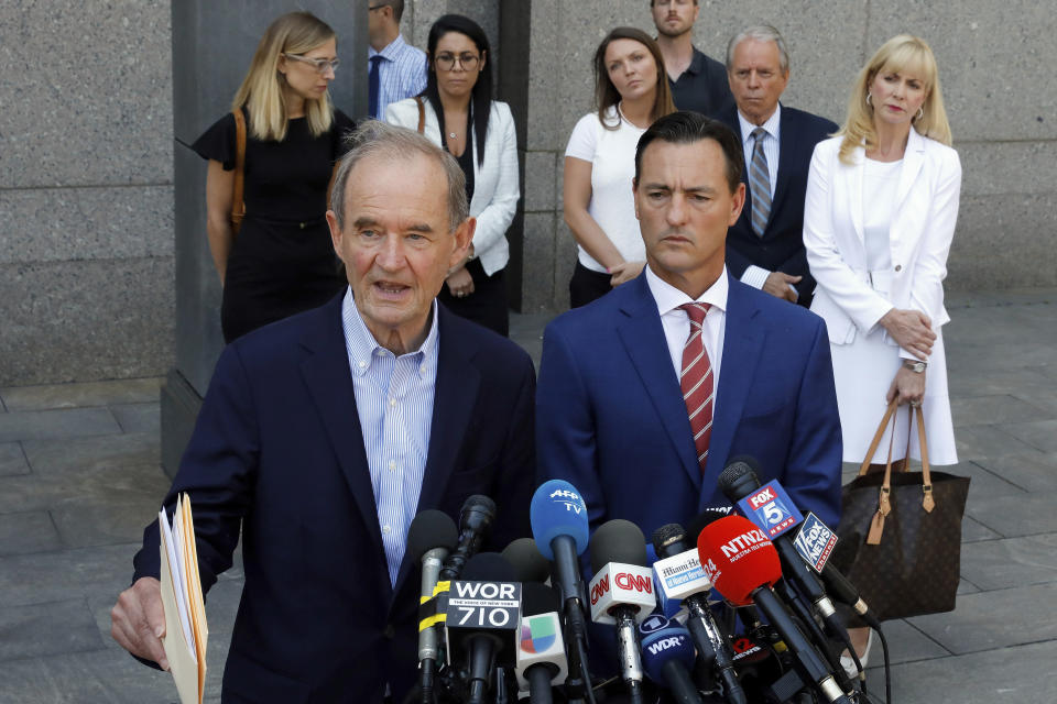 Attorneys David Boies, left, and Brad Edwards speak during a news conference outside federal court, in New York, Monday, July 15, 2019. Standing at background left is Annie Farmer, and background third left is Courtney Wild, two of Jeffrey Epstein's accusers who spoke at his bail hearing. (AP Photo/Richard Drew)