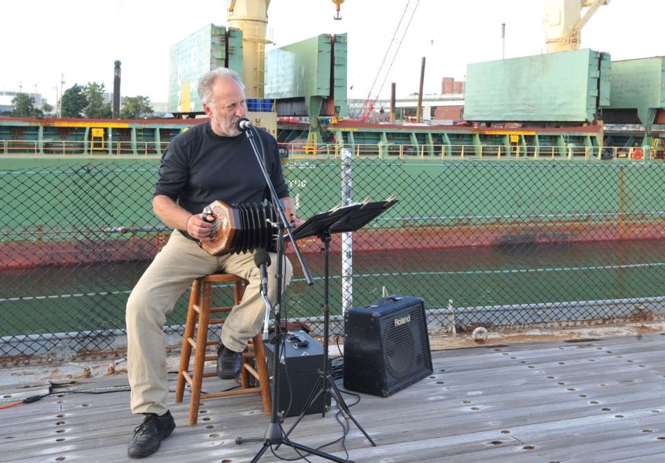David Coffin entertains during the Quincy Farmers Market Lobster Clambake on the USS Salem in Quincy, Tuesday, Sept. 21, 2021.