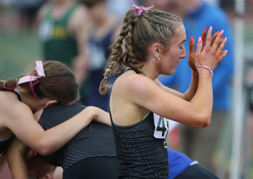 Padua's Molly Flanagan recovers after winning the Division I 800 meter race during the second day of the DIAA state high school track and field championships at Dover High School, Saturday, May 18, 2024.