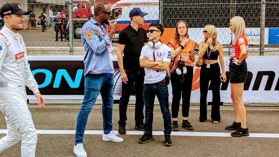 Jake Dennis (left) heads to his car as Usain Bolt walks the Formula E grid prior to the race in Mexico City (Karl Matchett)